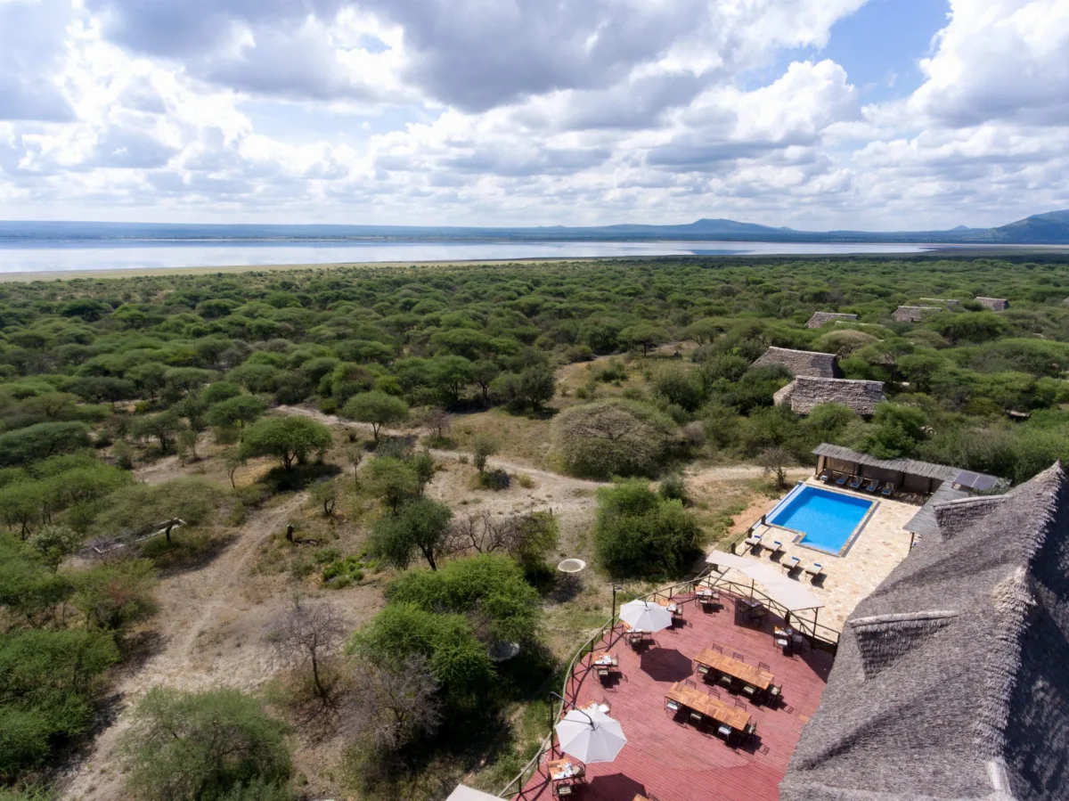 Aerial view of Lake Burunge Tented Lodge overlooking the bush and Lake Burunge