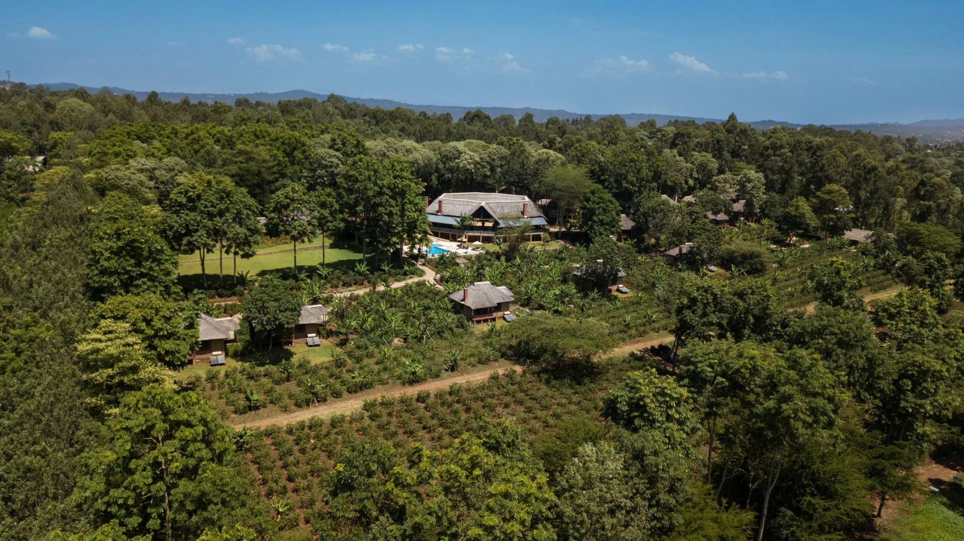 Aerial view of Kitela Lodge among coffee plantations and gardens in Karatu, Ngorongoro Highlands