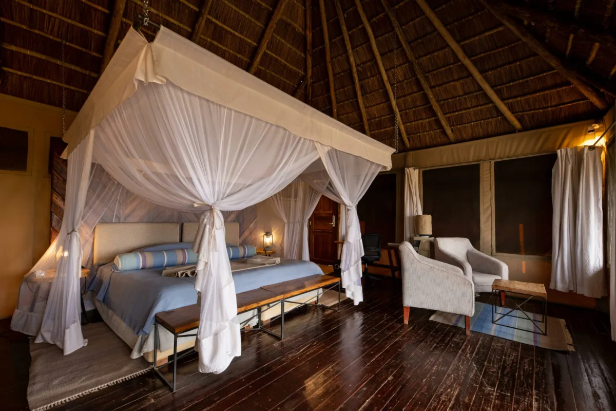 Tent interior with canopy bed at Kubu Kubu Tented Lodge