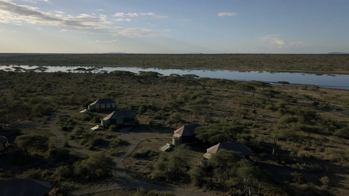 Aerial view of Masek Tented Lodge on the shore of Lake Masek