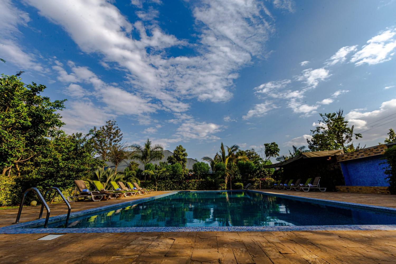 Swimming pool in the gardens at Airport Planet Lodge near Kilimanjaro Airport