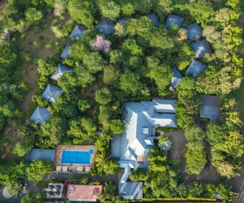 Aerial view of Airport Planet Lodge among tropical gardens