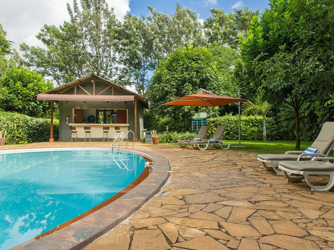 Swimming pool in the gardens at Arusha Planet Lodge