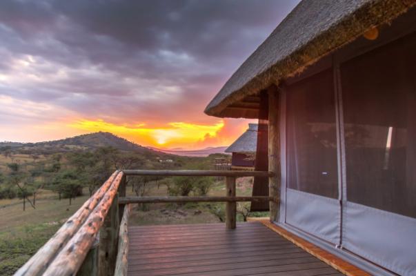Tent terrace at sunset at Lahia Tented Lodge