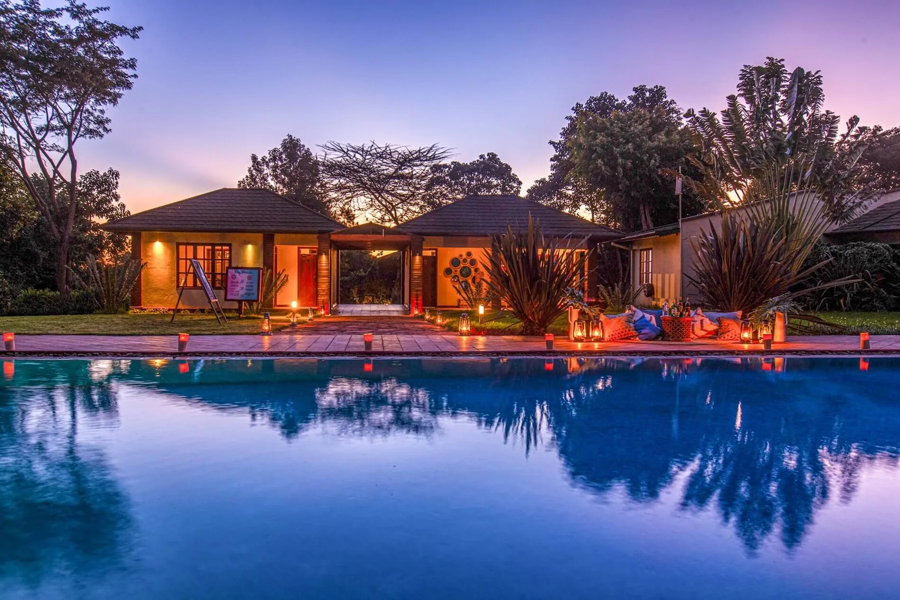 Swimming pool at dusk at Acacia Farm Lodge, Karatu