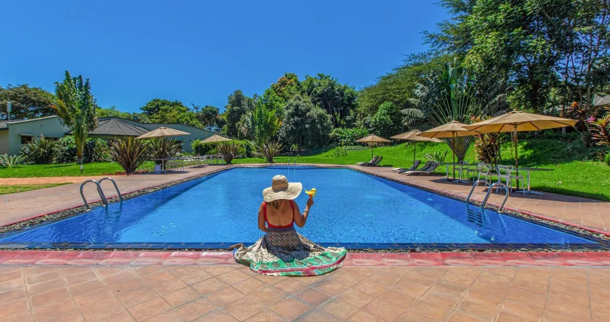 Swimming pool and gardens at Acacia Farm Lodge