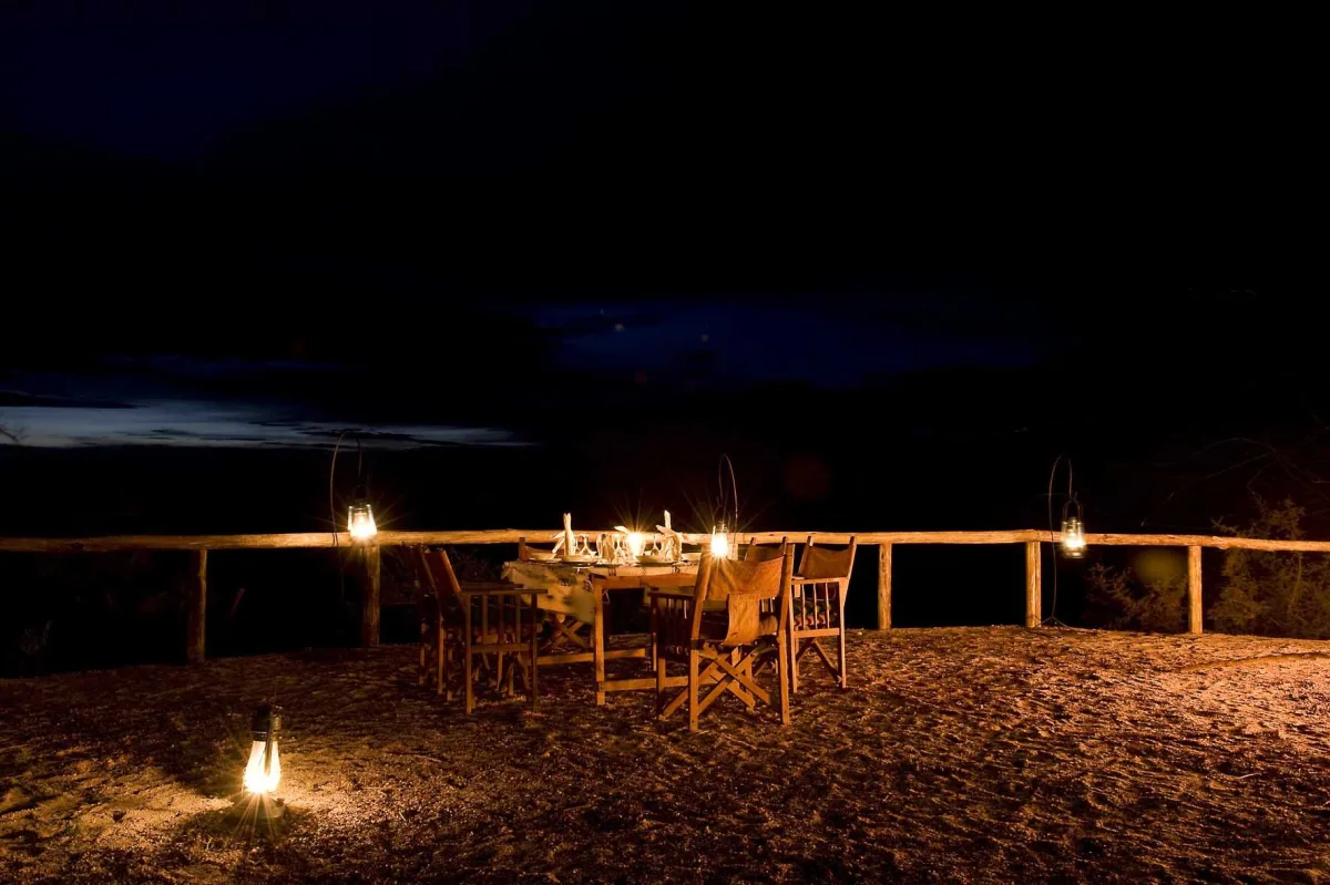 Dinner by lantern light at Kambi ya Tembo