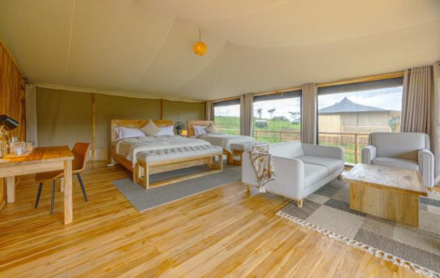 Triple tent interior at Lala Salama Serengeti Luxury Camp