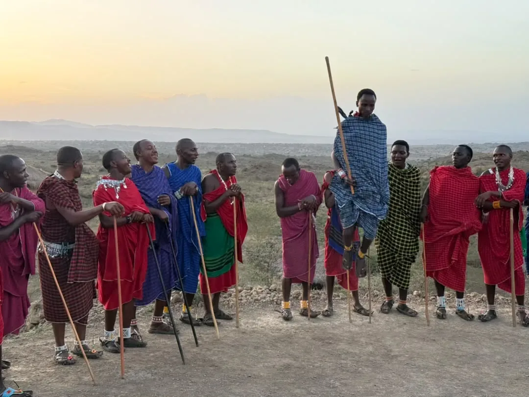 Maasai warriors performing the jumping dance at dusk at Osiligilai