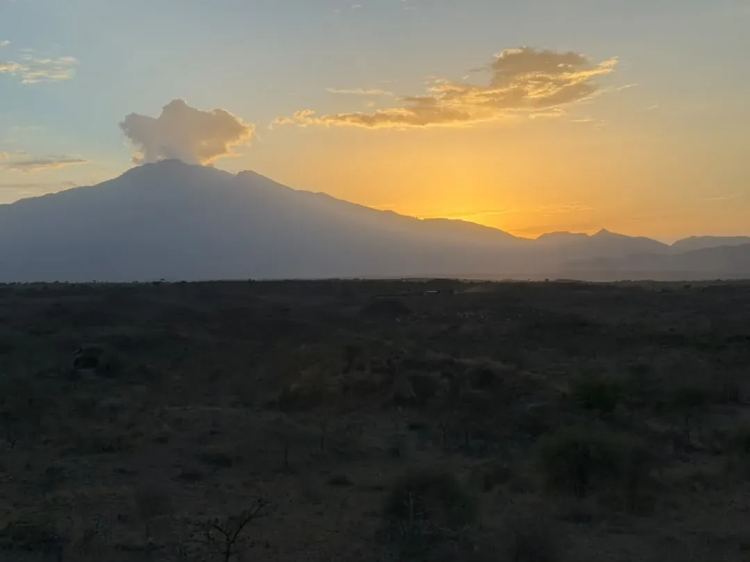 The sun setting behind the mountain seen from Osiligilai