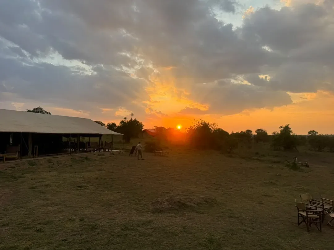 Western Corridor – The sun setting over a tented camp