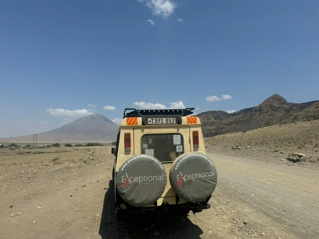 Our Exceptional Safaries Land Cruiser on the road to Lake Natron with Ol Doinyo Lengai behind
